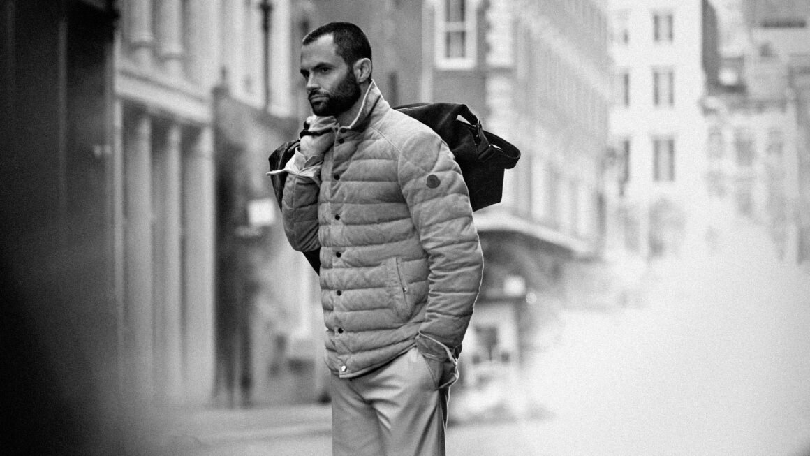 man in puffer jacket and a bag